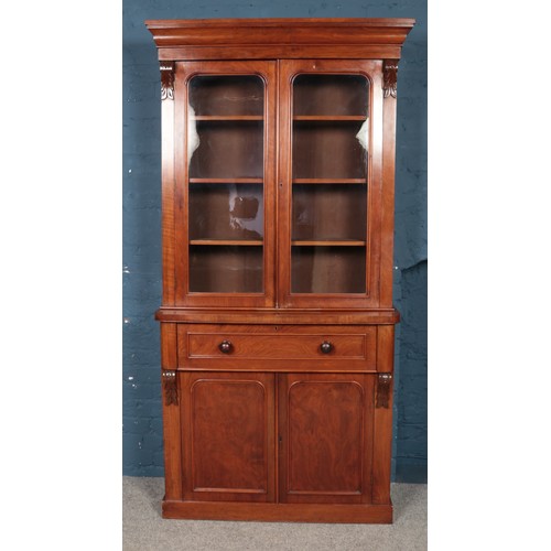 465 - A Victorian carved mahogany secretaire bookcase. With glazed top and fitted interior. Height 214.5cm... 