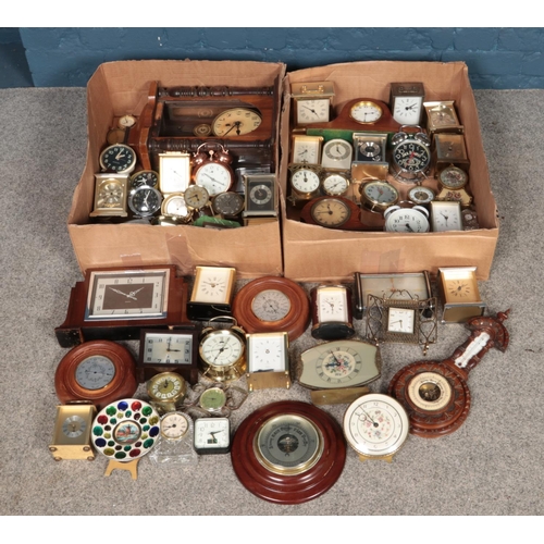 245 - Two boxes of assorted clocks, to include examples from Ingersoll, H. Samuel, Seiko and Acctim.