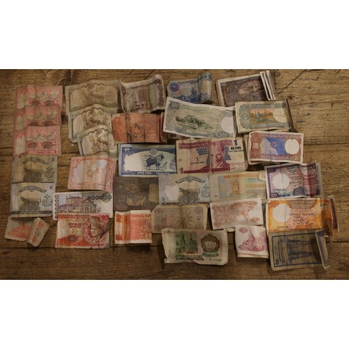 70 - A large quantity of world coins and banknotes including American, Indonesian and Singaporean example... 