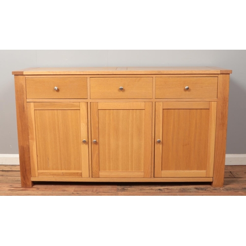 502 - A light oak sideboard.