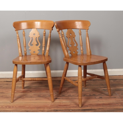 503 - Two beech kitchen chairs, with turned stretchers and feet.