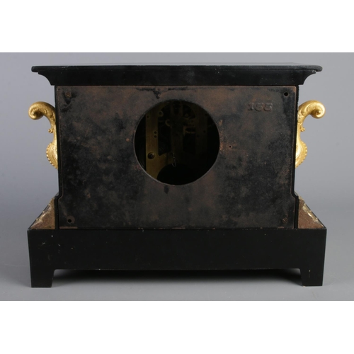 11 - A large black slate mantle clock, with Roman Numeral dial, raised on scrolled gilt metal feet and gi... 