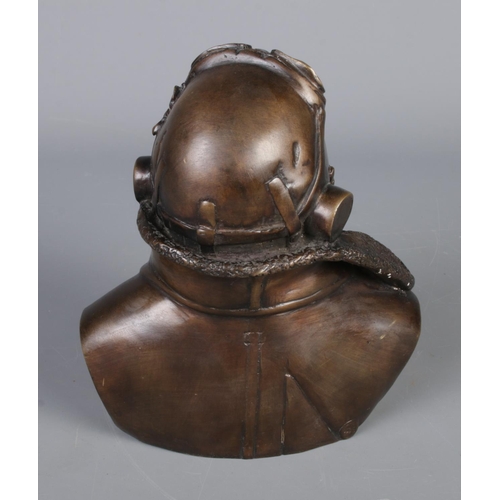 129 - A bronze bust depicting a fighter pilot, Signed RS to the back. (17cm)