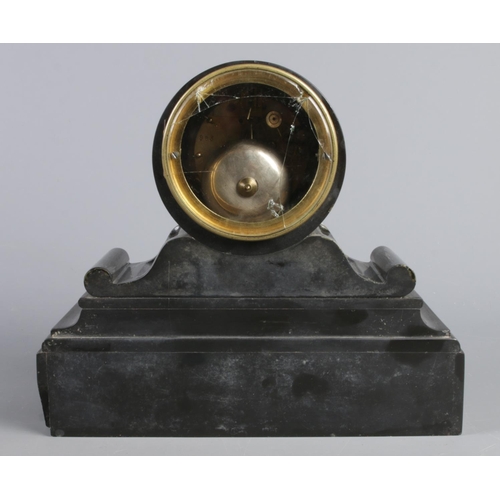 13 - A black slate mantel clock, in drum shaped case on stepped rectangular plinth. With Roman Numeral di... 