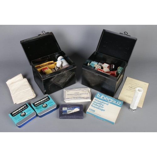 130 - Two metal first aid boxes with contents of medical supplies.