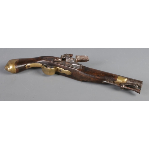 196 - A replica Tower stamped flintlock pistol.