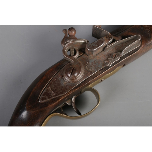 196 - A replica Tower stamped flintlock pistol.