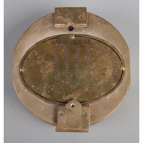 201 - A cased nautical brass compass, with 'Natural Sine' figures to the front and anchor inlaid in case.