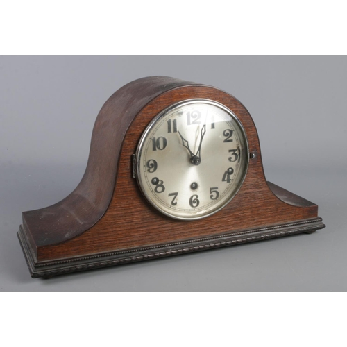 78 - A mahogany cased dome top mantel clock. The movement marked for Haller.