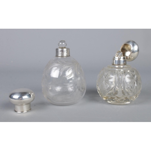 449 - Two silver topped globular scent bottles; one stamped for Birmingham, 1938, by Mappin and Webb (1029... 