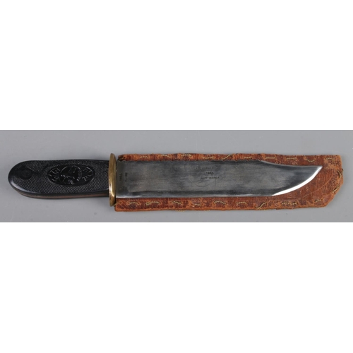 459 - A bowie knife, in leather sheath with Bayard handle and blade stamped for 'Smith, York' and 'T.Horsl... 