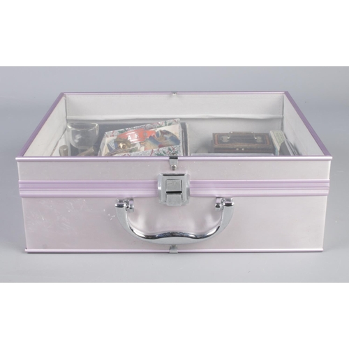 94 - A plastic topped case housing a good quantity of collectables. To include 1914-15 medal, white metal... 