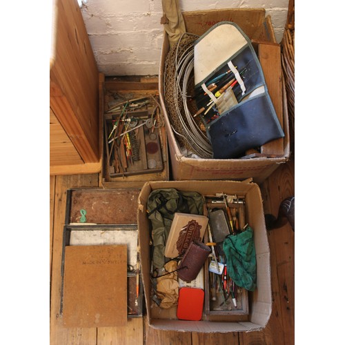 262 - A large collection of vintage fishing equipment. Includes rods, nets, wicker basket, floats and acce... 