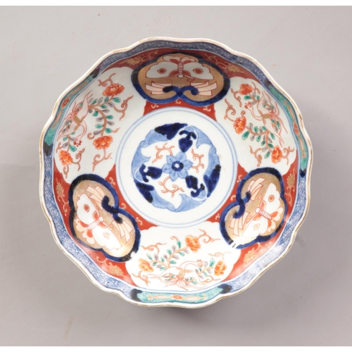 80 - A 19th Century Japanese Imari bowl bearing Fuki Chosun character marks to the base. Diameter 18cm.