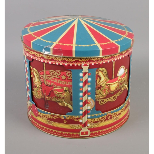 20 - A modern musical rotating biscuit tin in the form of a carousel. Working.