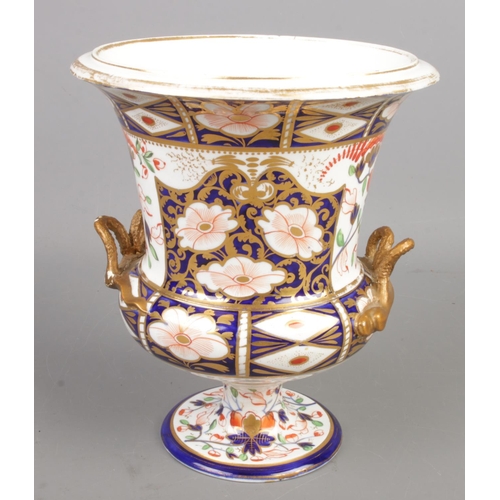 207 - A 19th century Royal Crown Derby twin handled vase. Imari design. (21cm)