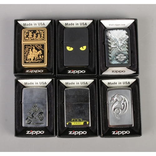 209 - Six vintage Zippo used lighters in original boxes including Harley Davidson, New York Taxi, Dragon, ... 