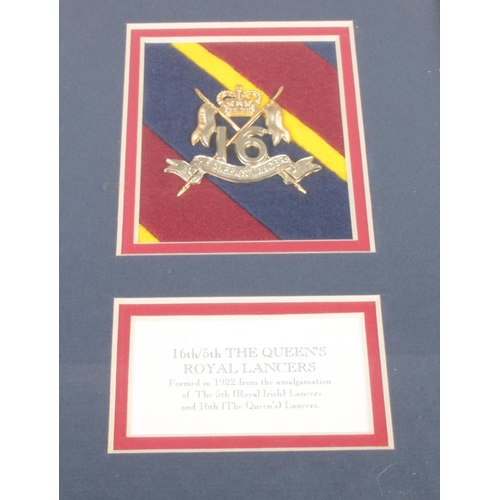 213 - A framed 16th/5th The Queen's Royal Lancers military cap badge.