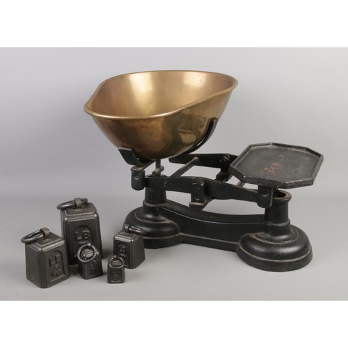 216 - A large set of cast iron scales with weights. Height 33cm.