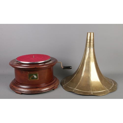 356 - Two Vintage 'His Masters Voice' wooden gramophones on circular bases. Both with brass funnels, one w... 