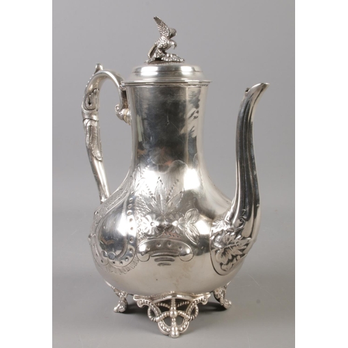 56 - A Victorian Sheffield plate hot water pot. With bird finial and engraved decoration. Approx 25cm hei... 