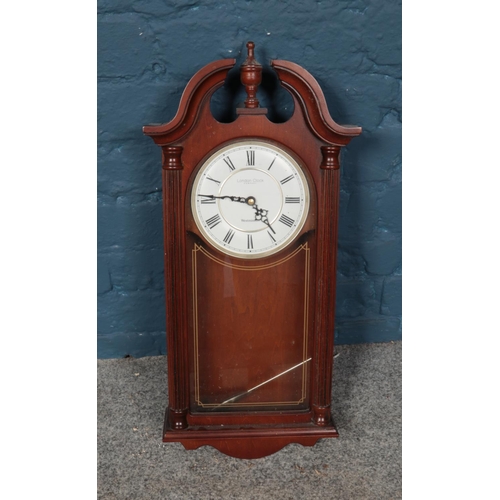 422 - A London Clock Co. quartz pendulum wall clock with Westminster chime.