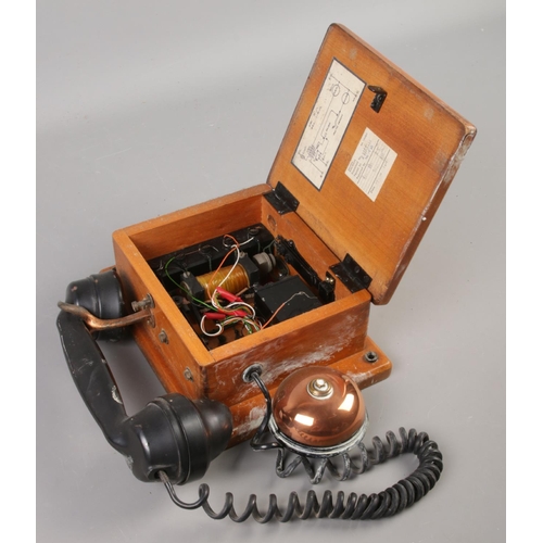 427 - A railway signal box telephone with receiver and bell, stamped 'Gents' to front and with service sti... 