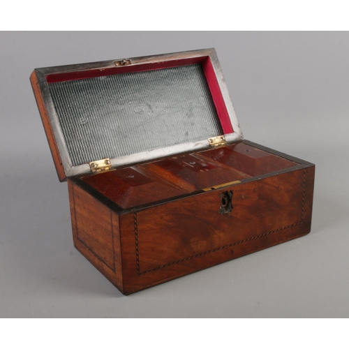 61 - A Victorian mahogany tea caddy. (24cm width 11.5cm height)