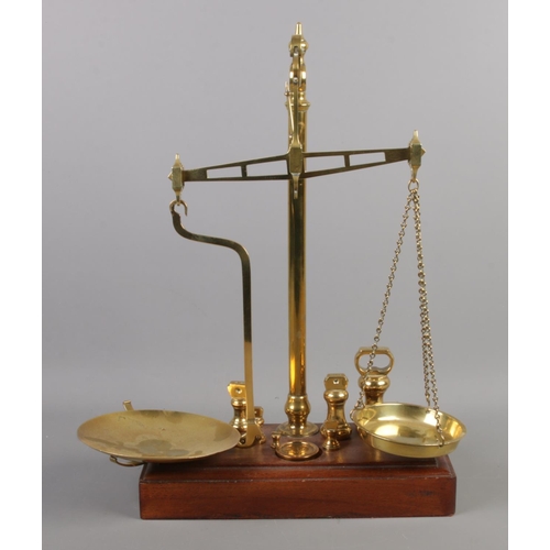 67 - A set of Day and Millward balance scales, complete with a harlequin set of weights, including Avery ... 