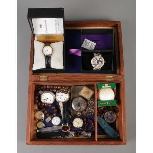 69 - A carved jewellery box with contents of collectables. To include ingersoll pocket watch, boxed quart... 