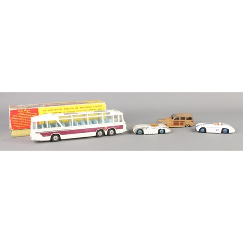 7 - Four vintage Dinky die-cast vehicles. To include boxed 952 Vega Major, 133 Cunningham x 2 and 344.