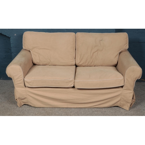 533 - An Ikea two seat sofa with beige cover. (90cm x 176cm)