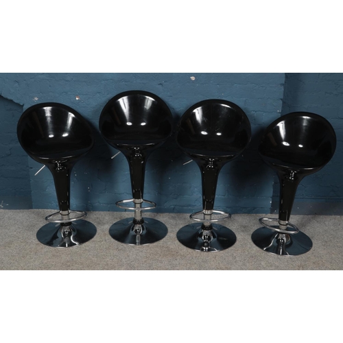 538 - Four swivel bar chairs with chrome supports.