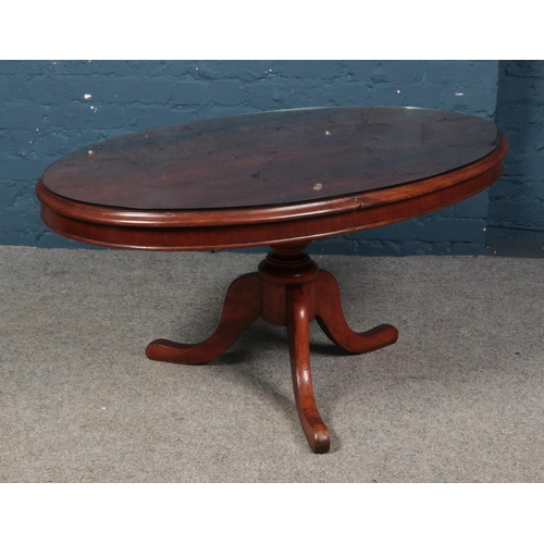 542 - A Victorian mahogany oval table with tripod base.