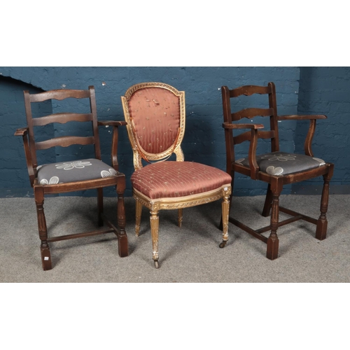 547 - A pair of carver dining chairs, together with a gilt occasional 'throne' chair, for repair.