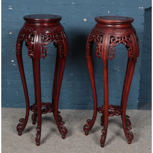 556 - A pair of Chinese hardwood plant stands.