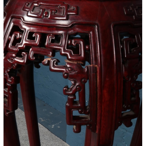 556 - A pair of Chinese hardwood plant stands.