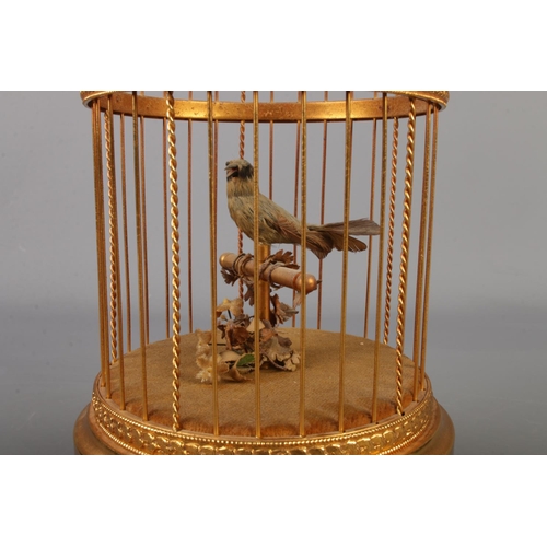 1 - A late Twentieth Century Reuge Music Swiss clockwork bird in cage automation. Stamped underneath Sai... 