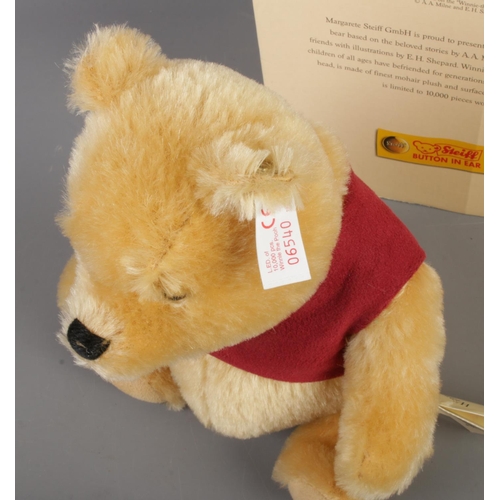 103 - A boxed Steiff Classic Winnie The Pooh bear. Limited Edition 06,540/10,000.