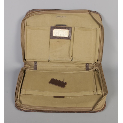 120 - A US WWII Pilots Navigation leather kit bag. Signed Chapman to interior with 1945 year calendar.