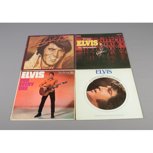 14 - Four Elvis Presley vinyl records including From Elvis in Memphis, Welcome To My World, A Legendary P... 