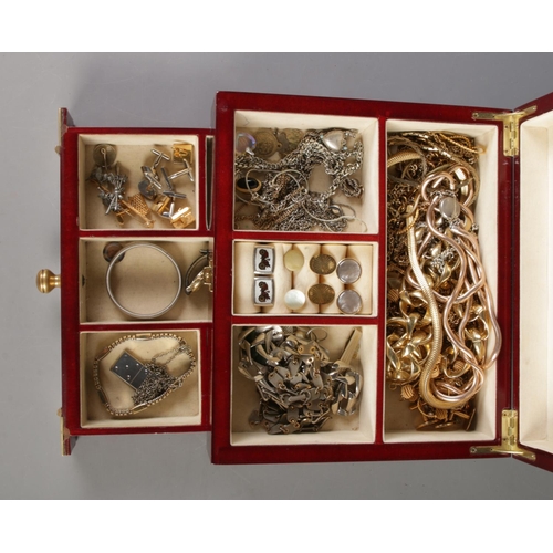 148 - A hinged jewellery box, with contents of costume jewellery to include chains, cufflinks, bracelets a... 