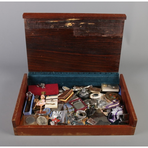 151 - A bijouterie case containing a very good assortment of collectables, to include teething ring, light... 