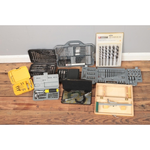 249 - A quantity of cased tool sets including Speed Read clamps, Whitworth measure, auger set, drill bits,... 