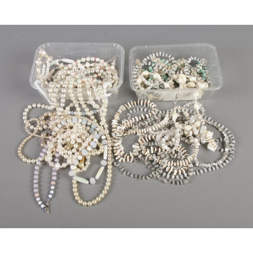 46 - Two trays of necklaces including simulated pearl and gemstone chip examples.