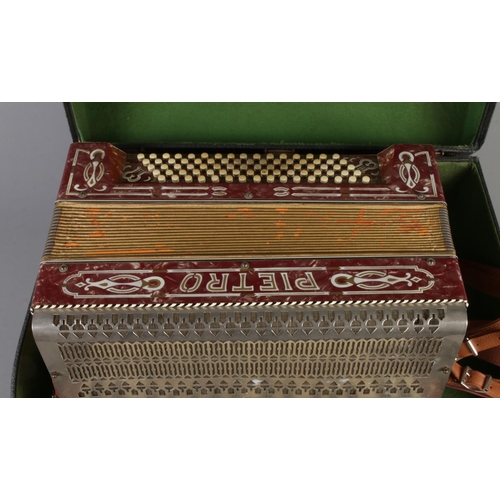 271 - A cased Pietro accordion.