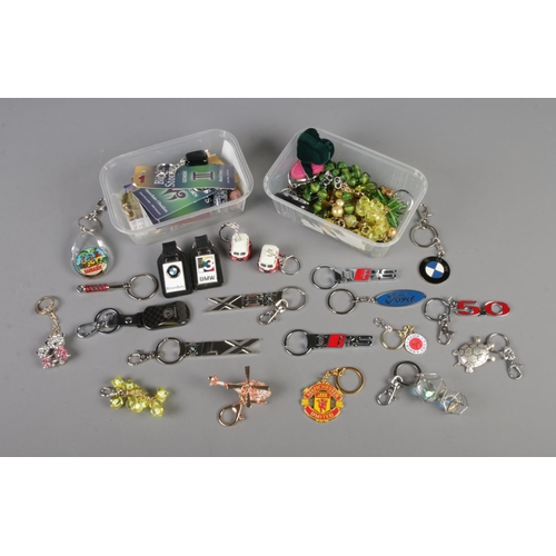 47 - A quantity of keyrings to include several novelty and motoring examples such as BMW, Audi, Ford, etc... 