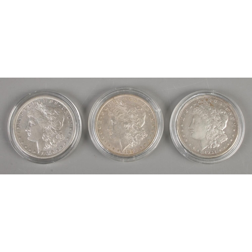 403 - Three American one dollar coins; dated 1879 (26.7g), 1896 (26.7g) and 1921 (26.8g).