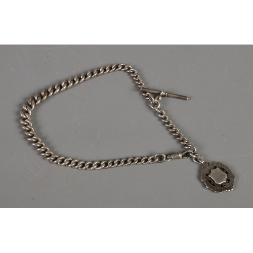 444 - A late Victorian silver albert chain and later fob. Total weight: 67.9g.