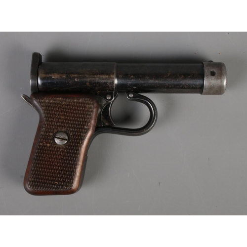 483 - A German DRGM Tell II DRP .177 air pistol featuring wooden grips. CAN NOT POST OVERSEAS